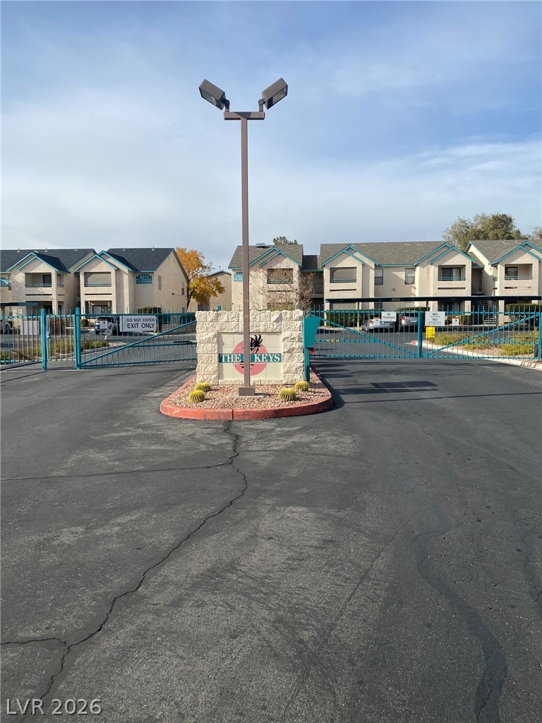 5271 South Lindell Road, Unit 202 Las Vegas, NV 89118 - Photo 4 of 27 Secure community entrance featuring a gate and landscaped monument welcomes you home.