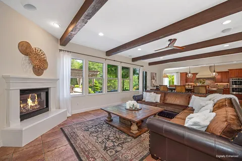 a spacious bathroom with a granite countertop double vanity sink mirror bathtub and shower