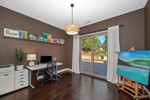 a spacious bedroom with a bed and a window