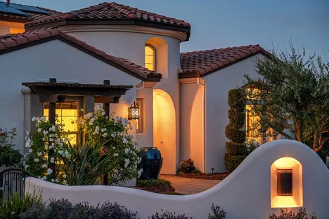 a front view of a house with garden