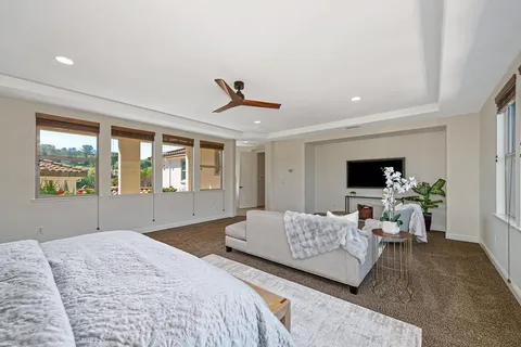 a view of a backyard with seating area and green space