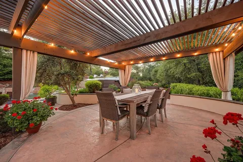 a view of a swimming pool with sitting area