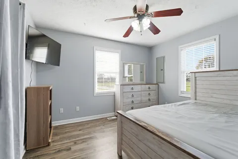 a room with a bed and a chandelier