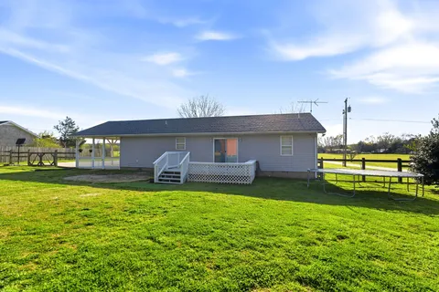 a front view of house with yard and porch