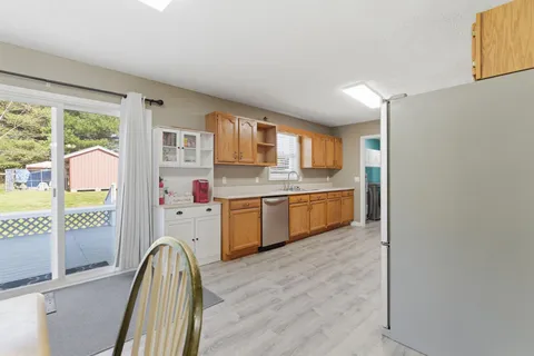 a kitchen with a sink stove and refrigerator