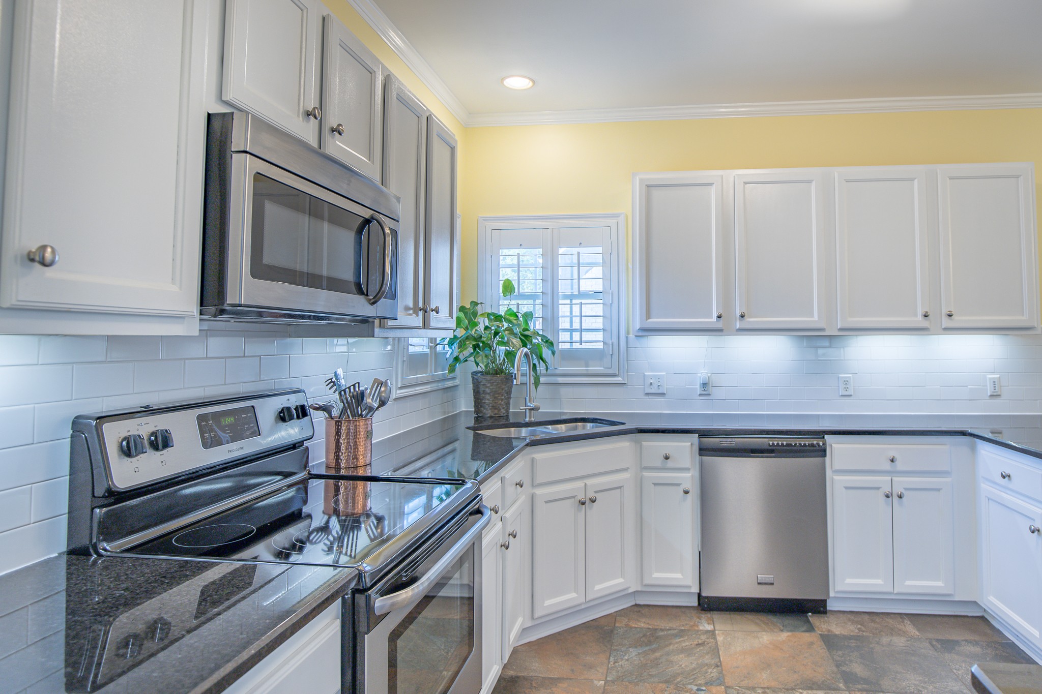 4119 Lazarus Way Murfreesboro, TN 37128 - Photo 13 of 47 a kitchen with white cabinets appliances and a sink