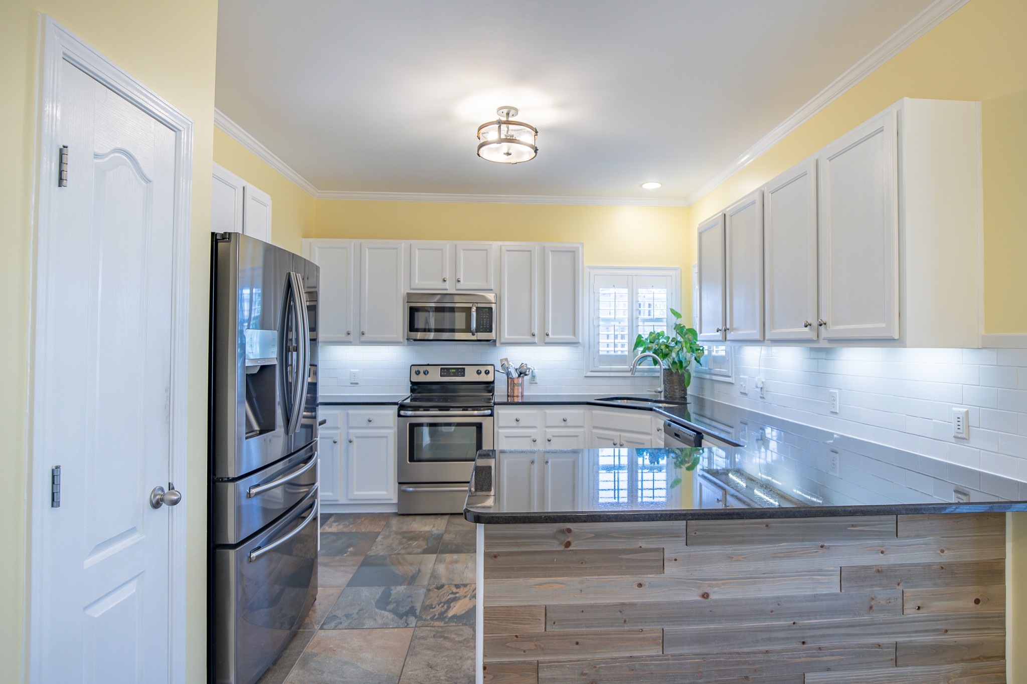 4119 Lazarus Way Murfreesboro, TN 37128 - Photo 14 of 47 a kitchen with stainless steel appliances granite countertop a refrigerator sink and stove