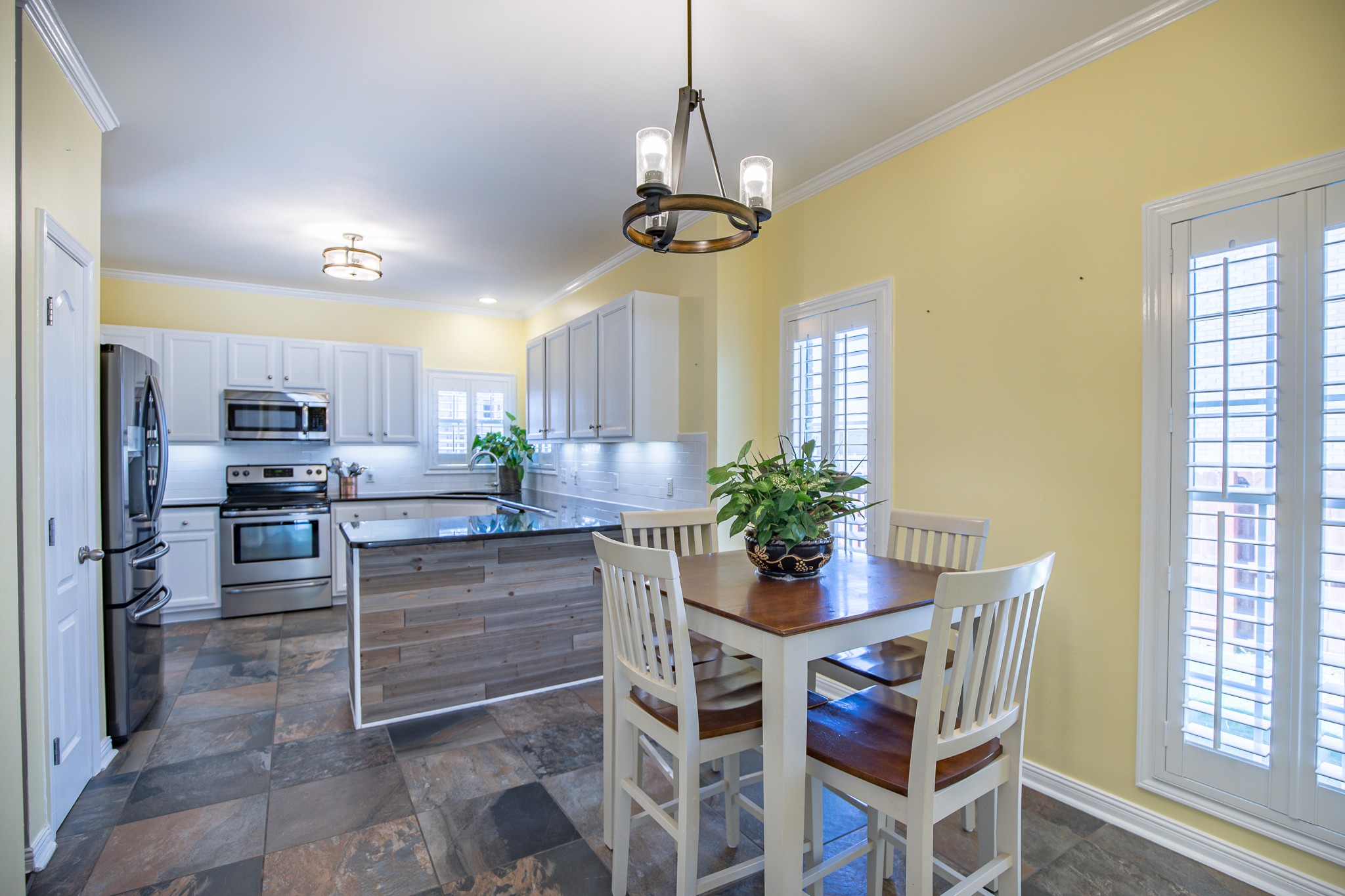 4119 Lazarus Way Murfreesboro, TN 37128 - Photo 24 of 47 a room with stainless steel appliances a dining table chairs and windows