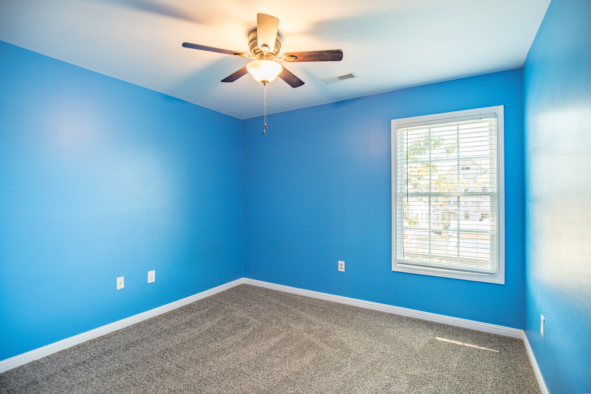 4119 Lazarus Way Murfreesboro, TN 37128 - Photo 31 of 47 an empty room with a chandelier fan and windows