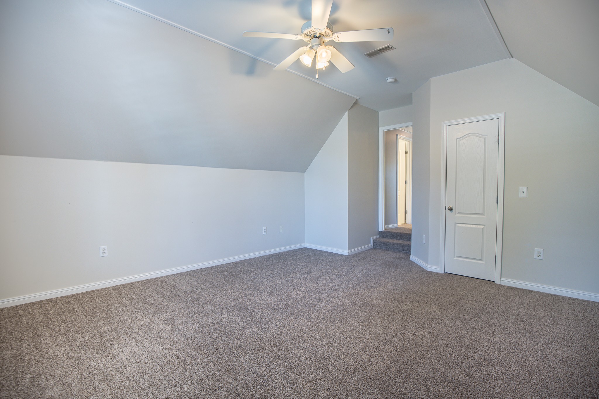 4119 Lazarus Way Murfreesboro, TN 37128 - Photo 37 of 47 an empty room with a chandelier fan and closet area