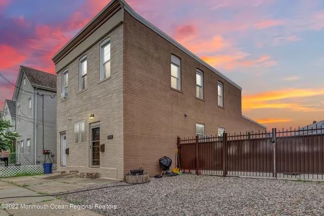 a front view of a house with parking space