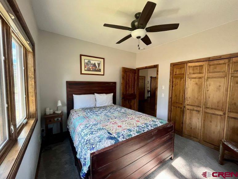 592 South Badger Trail Ridgway, CO 81432 - Photo 15 of 29 a bedroom with a bed and a refrigerator