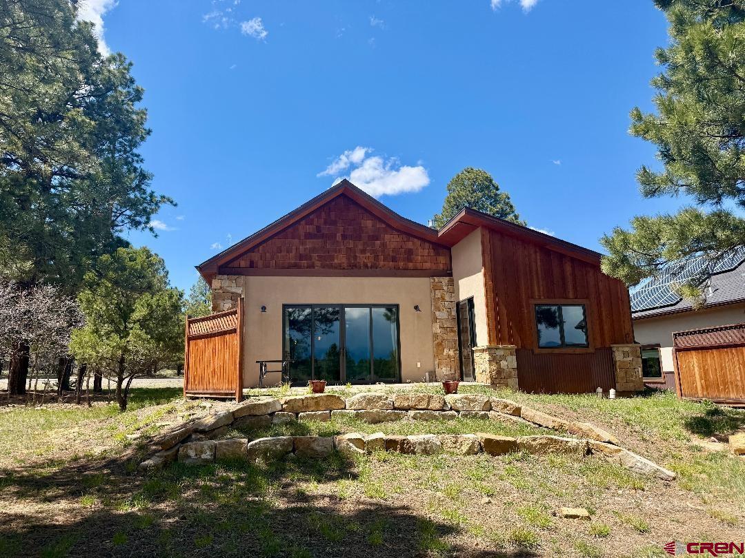 592 South Badger Trail Ridgway, CO 81432 - Photo 2 of 29 a view of a house with a yard