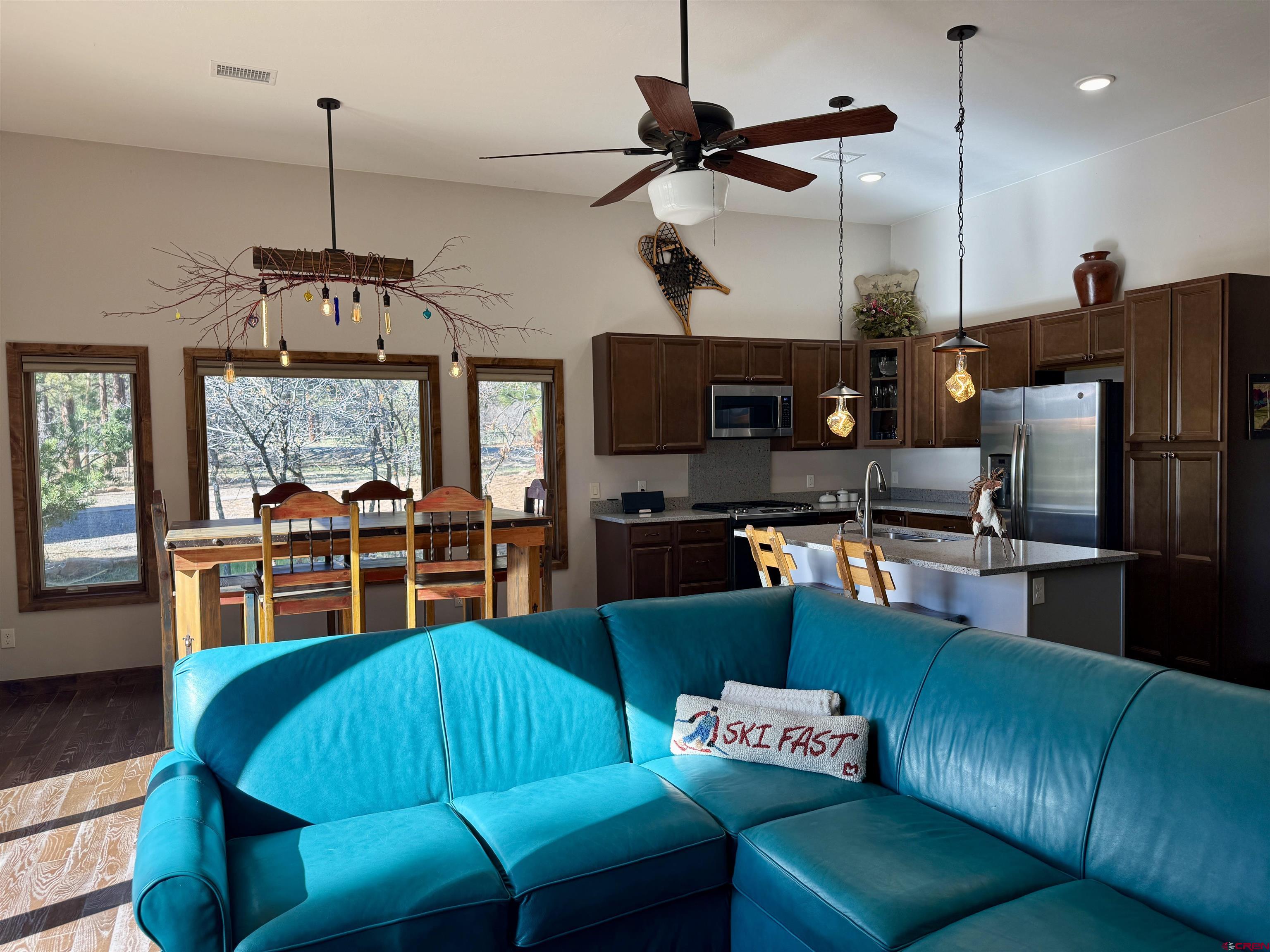 592 South Badger Trail Ridgway, CO 81432 - Photo 3 of 29 a living room with furniture a ceiling fan and a window