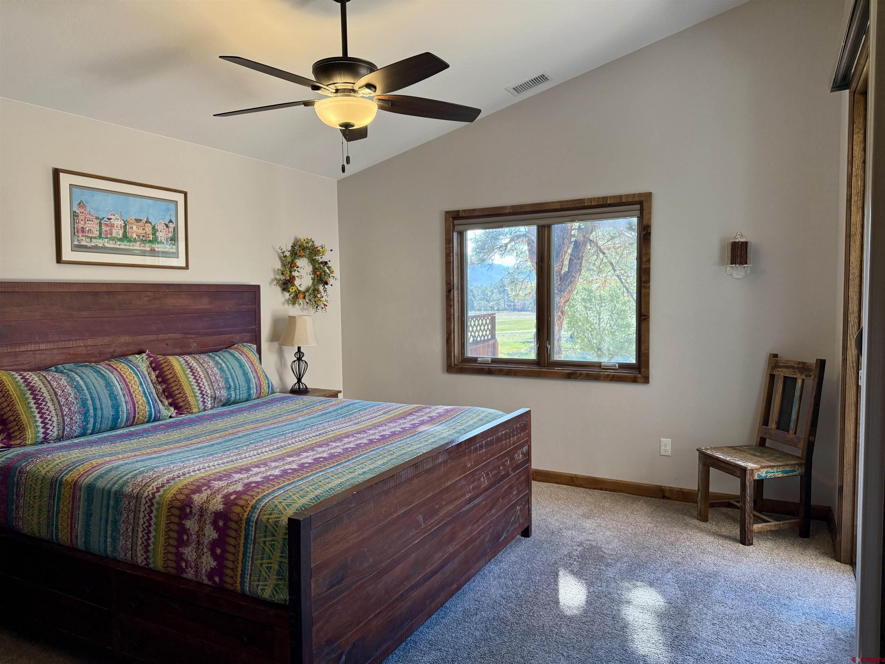 592 South Badger Trail Ridgway, CO 81432 - Photo 10 of 29 a bedroom with a bed and a window