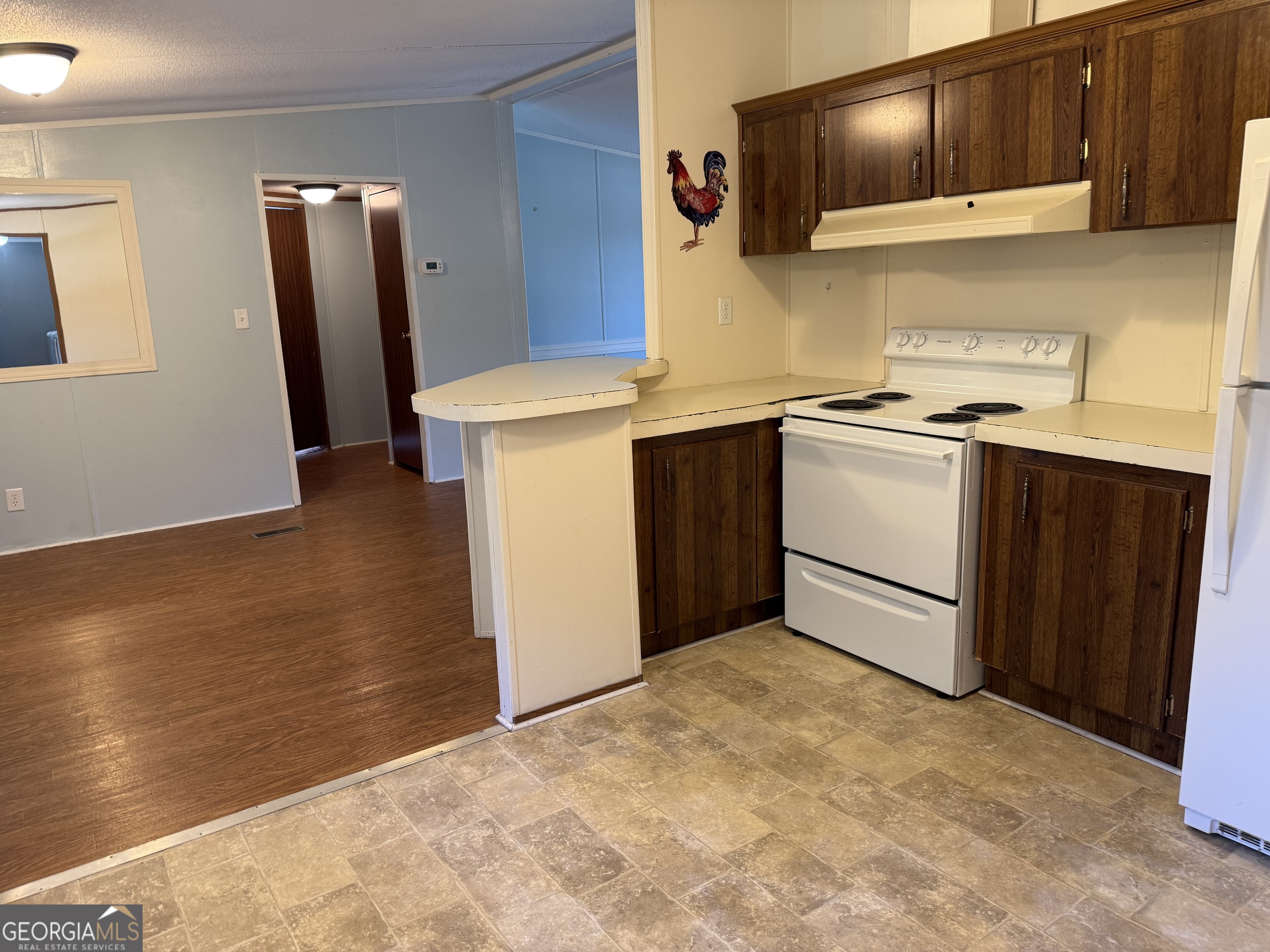 802 Ash Branch Road Pembroke, GA 31321 - Photo 12 of 27 a kitchen with a sink and a stove top oven