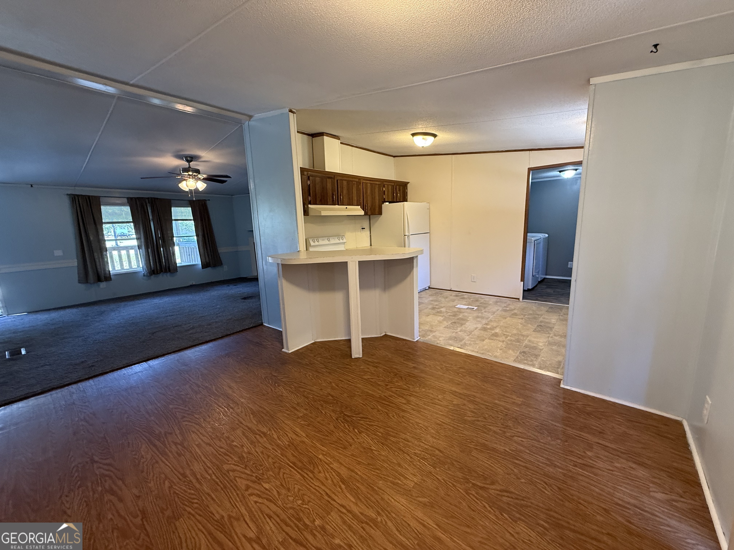 802 Ash Branch Road Pembroke, GA 31321 - Photo 15 of 27 a view of an empty room with window and wooden floor