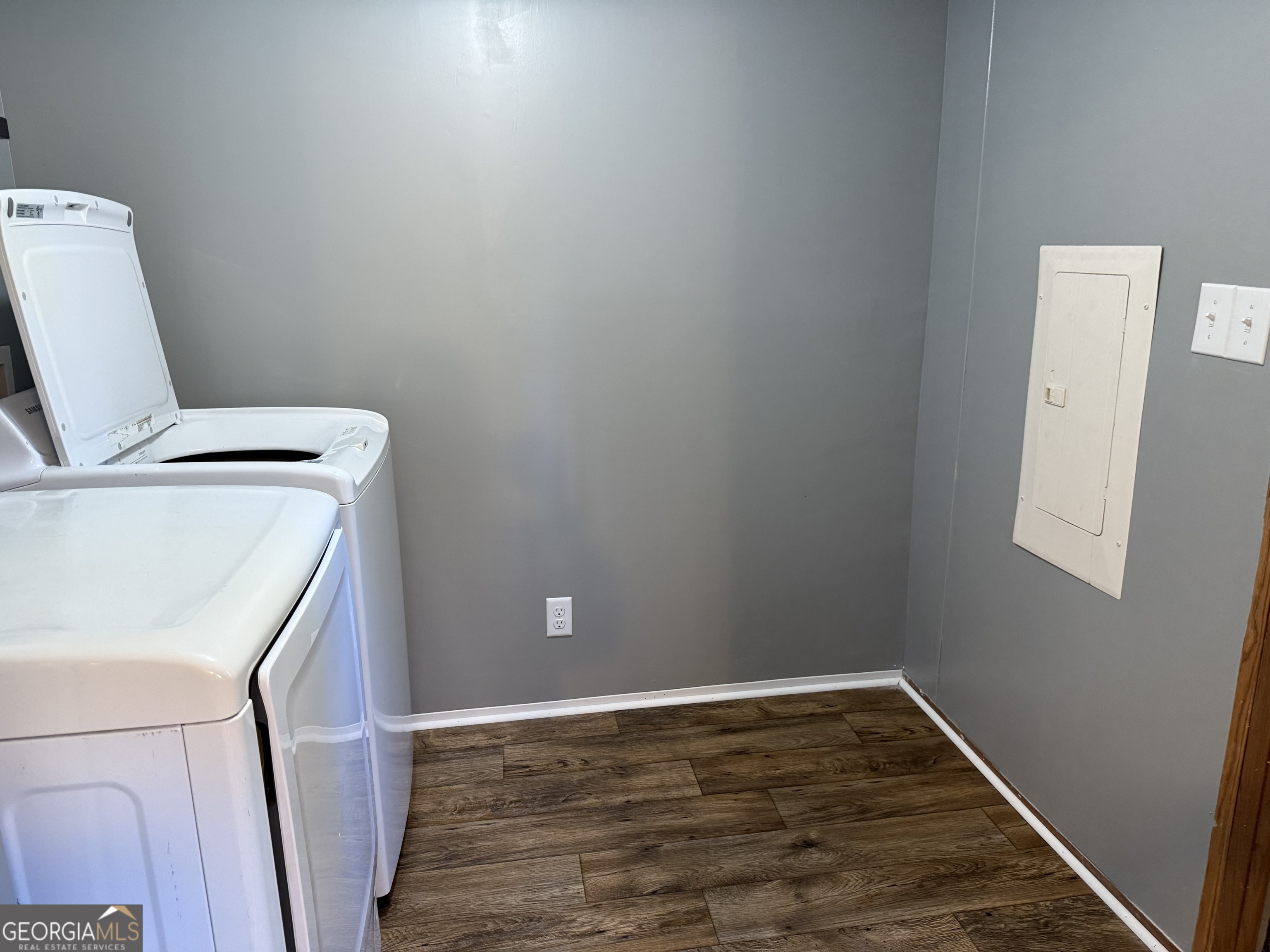 802 Ash Branch Road Pembroke, GA 31321 - Photo 16 of 27 a view of a storage and utility room with a washer and dryer