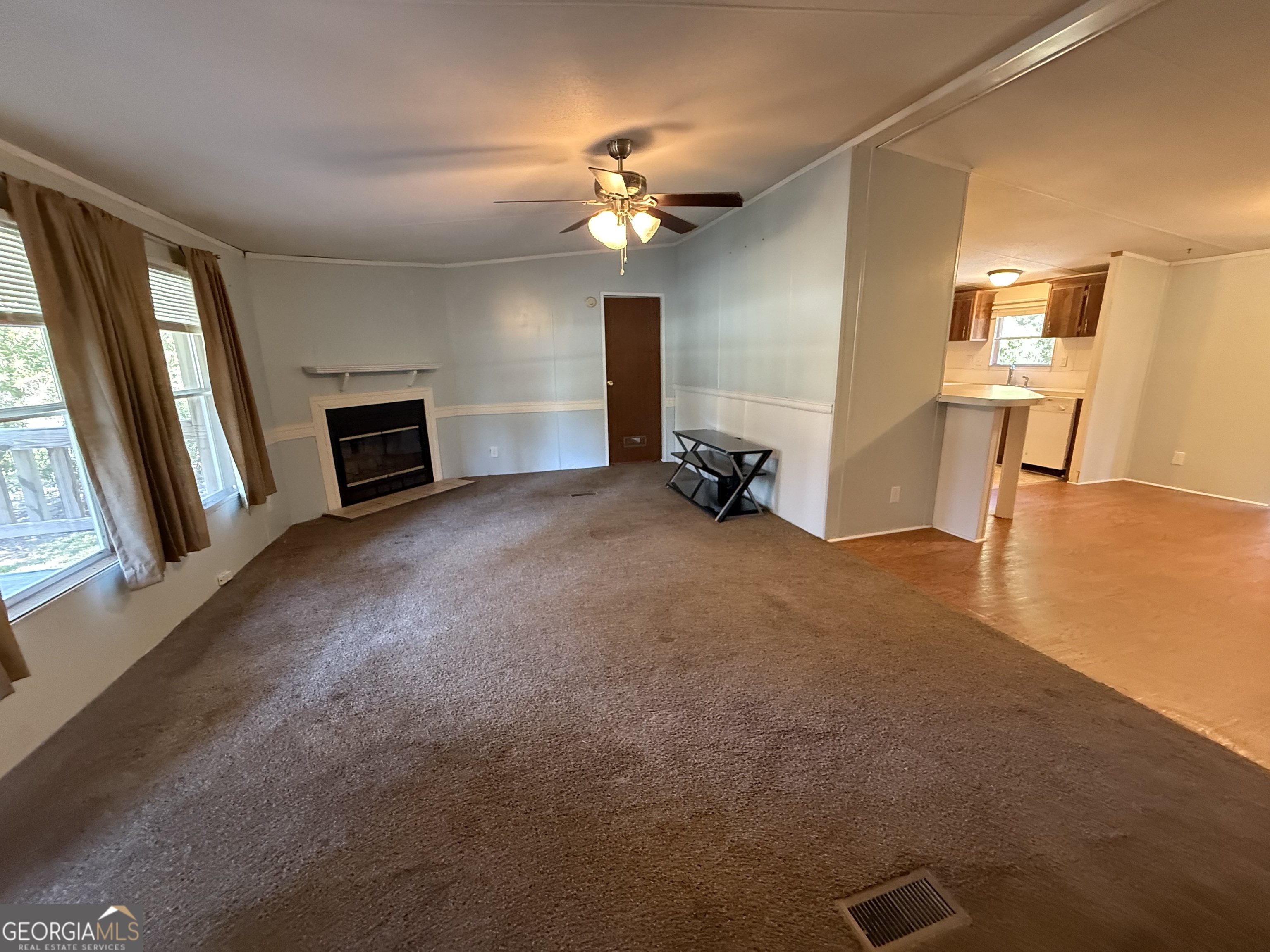 802 Ash Branch Road Pembroke, GA 31321 - Photo 18 of 27 a view of a livingroom with a ceiling fan and window