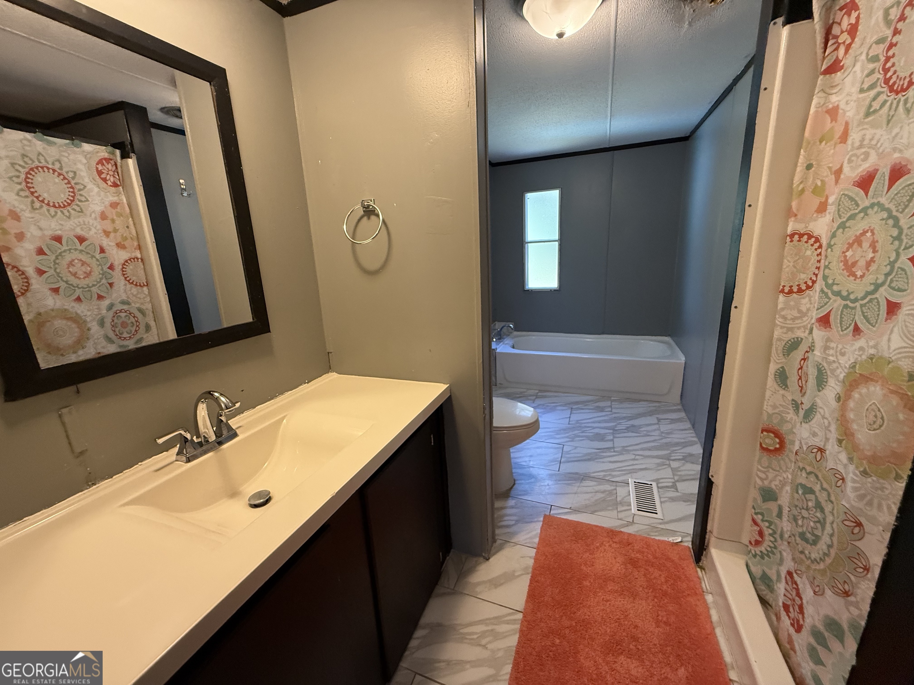 802 Ash Branch Road Pembroke, GA 31321 - Photo 22 of 27 a bathroom with a sink and a mirror