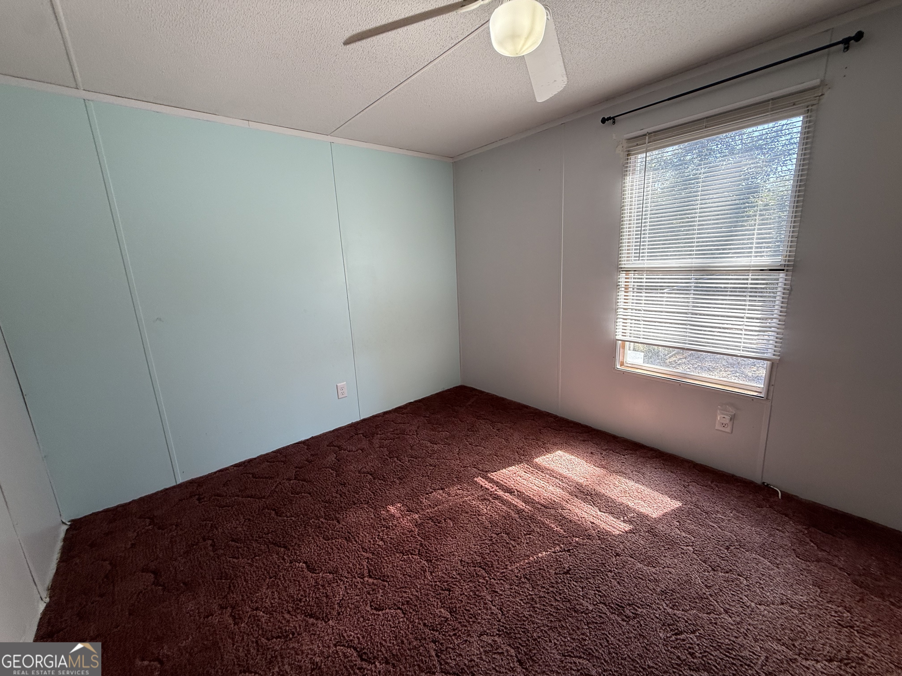 802 Ash Branch Road Pembroke, GA 31321 - Photo 26 of 27 a view of an empty room with wooden floor and a window