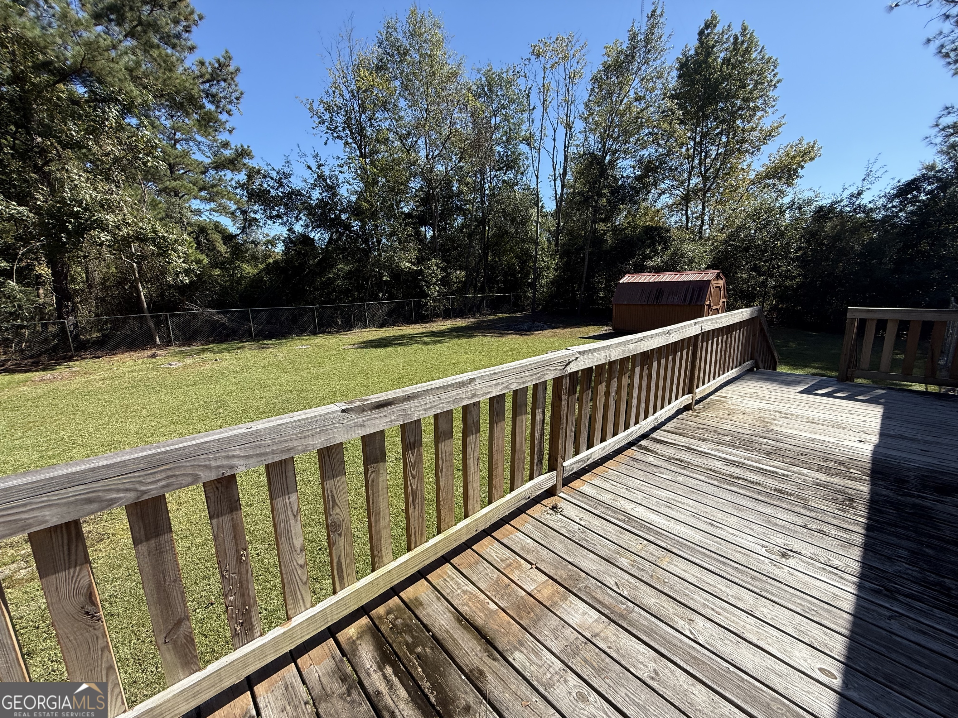 802 Ash Branch Road Pembroke, GA 31321 - Photo 7 of 27 a view of balcony with wooden floor and fence