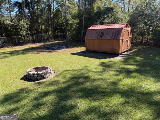 a view of a backyard with swimming pool