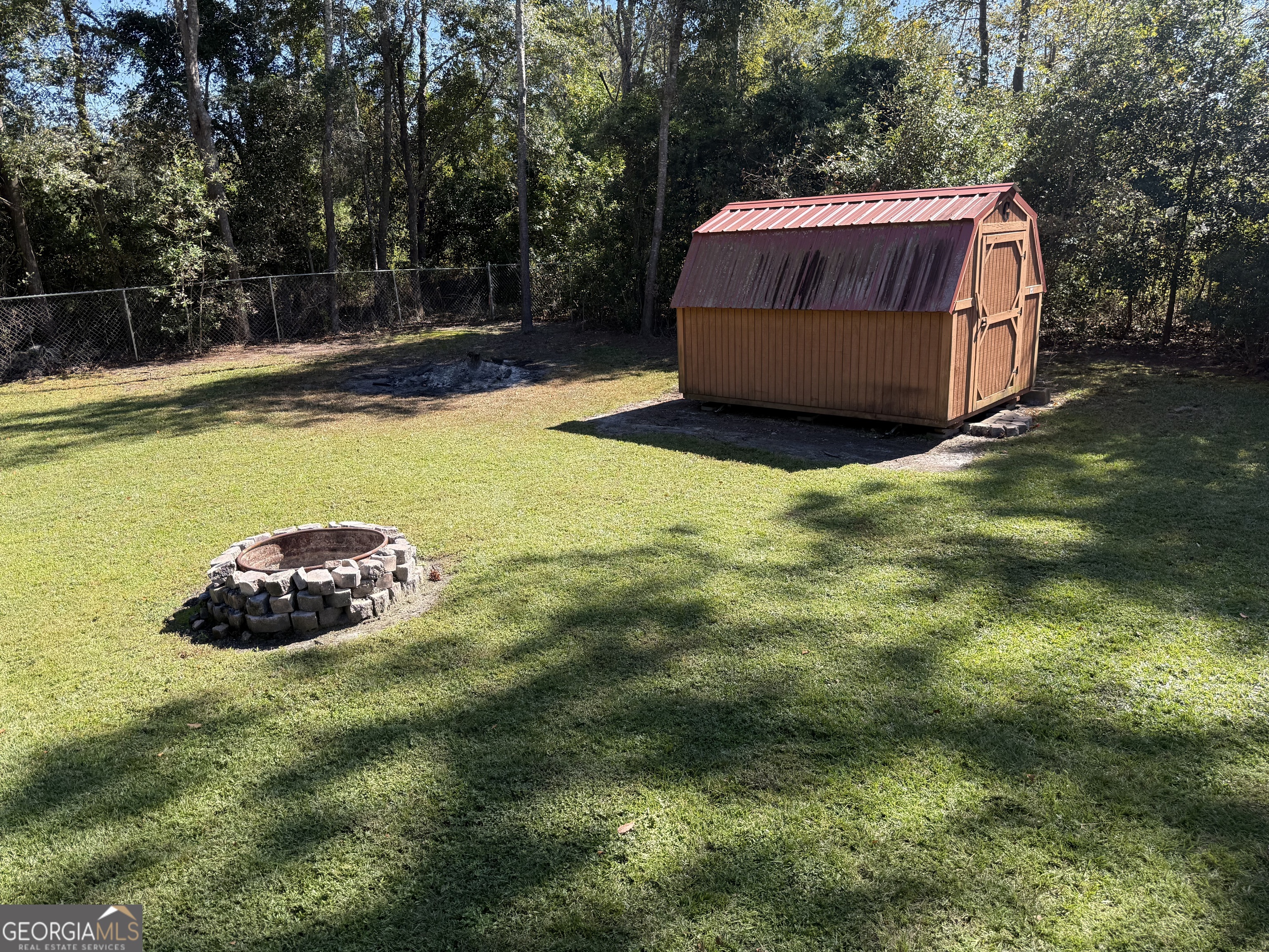 802 Ash Branch Road Pembroke, GA 31321 - Photo 10 of 27 a view of a backyard with swimming pool