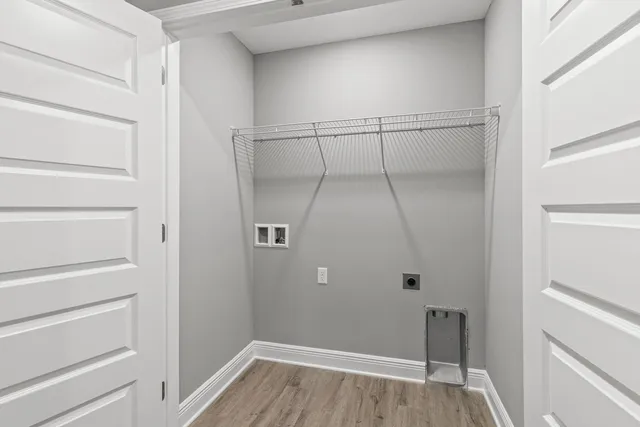 a view of a room with wooden floor