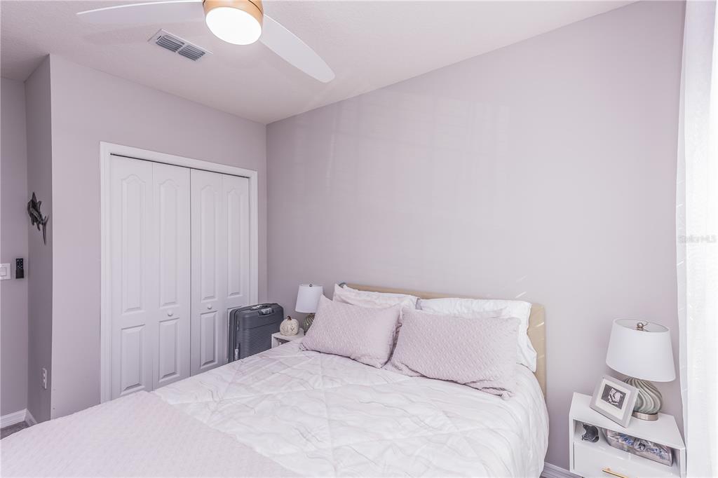 220 Evertree Loop Sanford, FL 32771 - Photo 23 of 31 a large bed in a white room