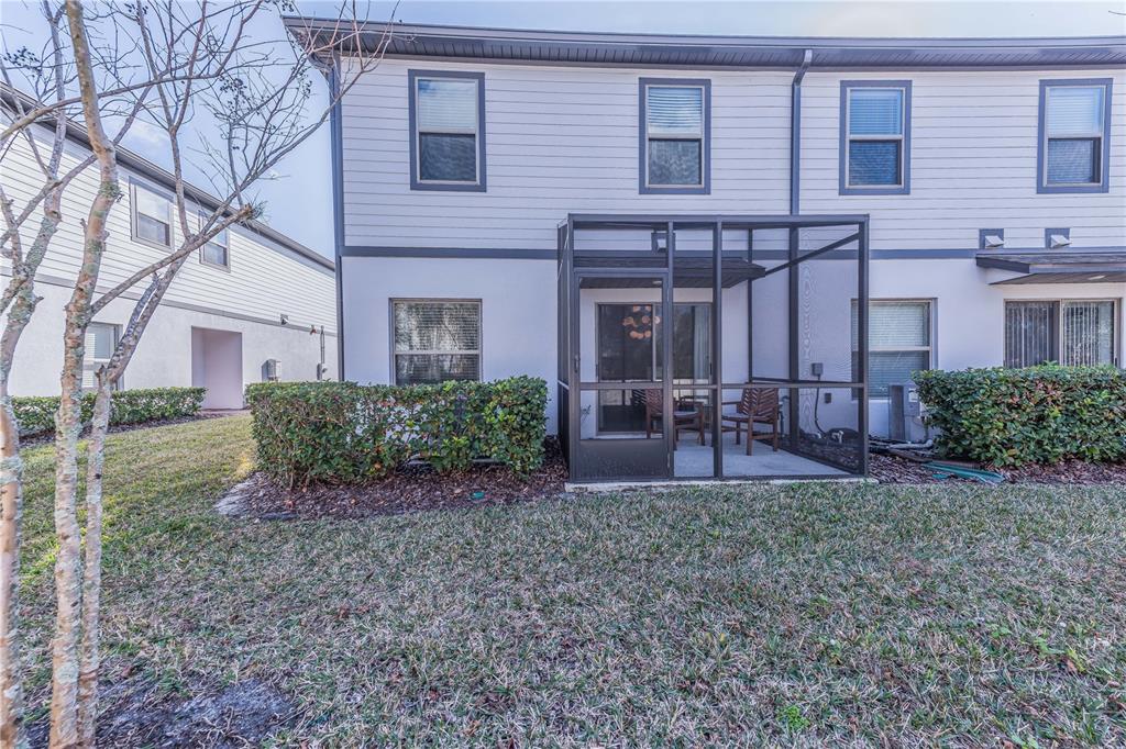 220 Evertree Loop Sanford, FL 32771 - Photo 27 of 31 a view of a house with a yard and sitting area