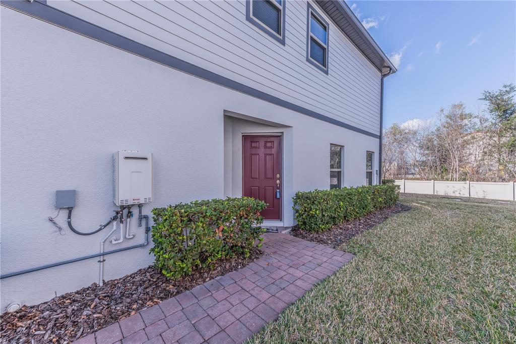 220 Evertree Loop Sanford, FL 32771 - Photo 5 of 31 a front view of a house with garden
