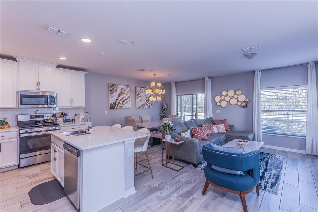 220 Evertree Loop Sanford, FL 32771 - Photo 6 of 31 a kitchen that has a table and chairs in it