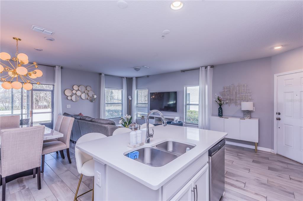 220 Evertree Loop Sanford, FL 32771 - Photo 7 of 31 a view of a dining room with furniture and wooden floor