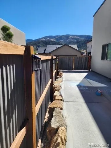 a bedroom with a bed and a large mirror