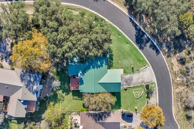 a backyard of a house with outdoor seating