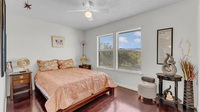 a bedroom with a bed and a chair