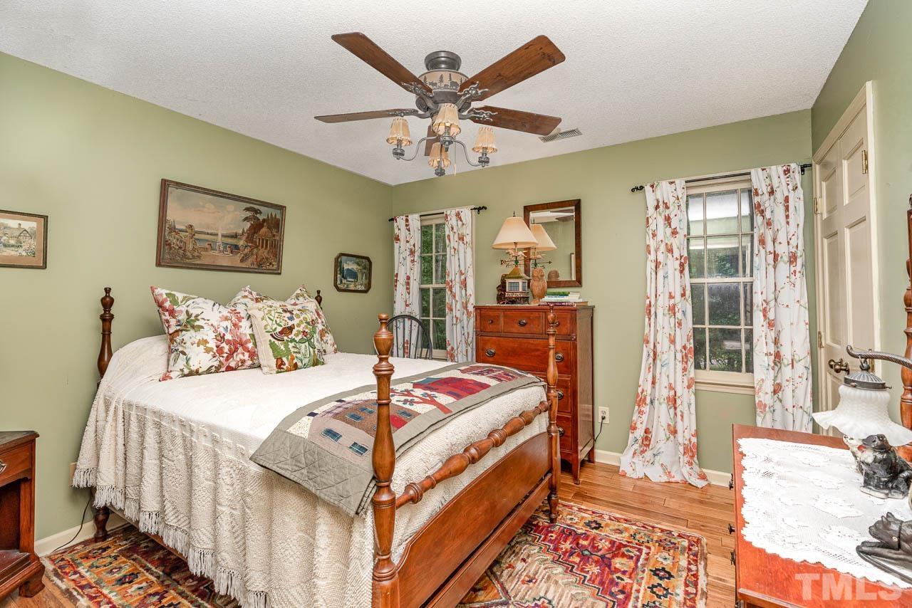 2025 Valley Ridge Court Raleigh, NC 27603 - Photo 26 of 32 a bedroom with bed and wooden floor