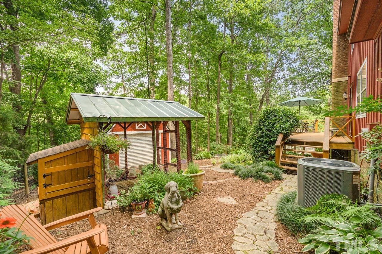 2025 Valley Ridge Court Raleigh, NC 27603 - Photo 6 of 32 a front view of a house with garden