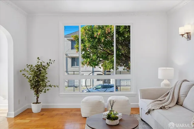 a view of living room with furniture and window