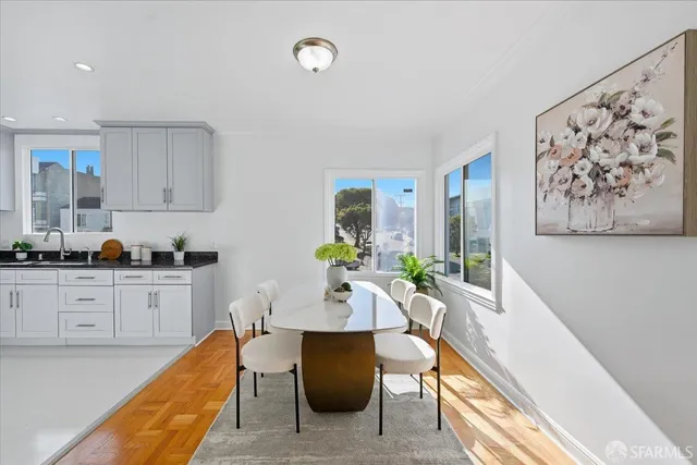 a kitchen with stainless steel appliances granite countertop a stove and a sink