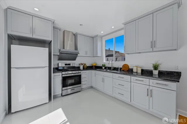 a bedroom with a bed a mirror and vanity