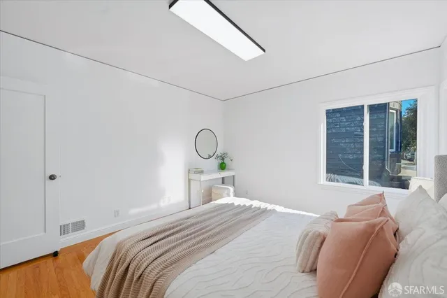 a view of entryway and hall with a front door