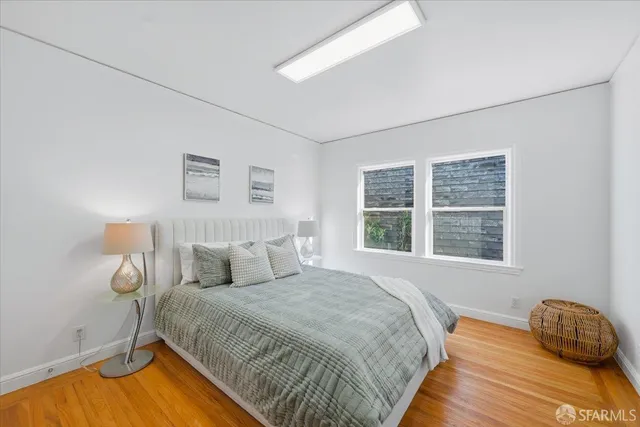 a living room with furniture and potted plant