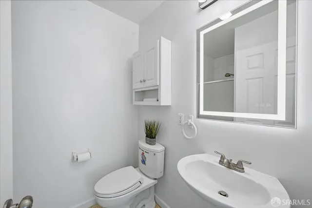 a view of a city street with tall buildings