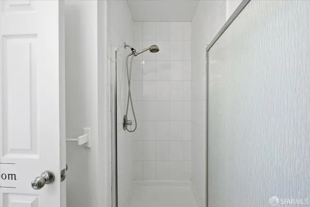 a picture of a bench in front of a wall