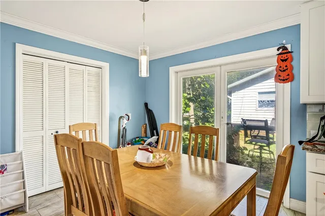 a view of a dining room with furniture window and outside view