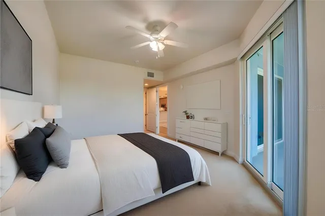 a bathroom with a granite countertop tub sink and mirror