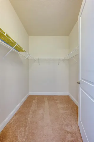 an empty room with a view of bathroom