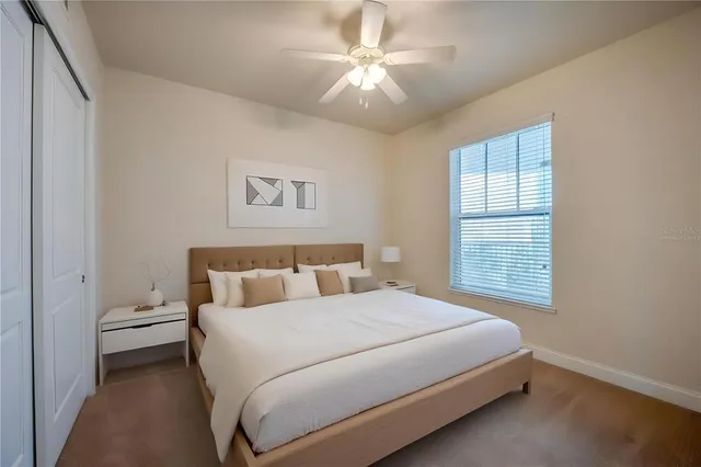 a bathroom with a granite countertop sink a toilet and bathtub